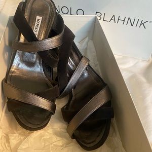 $850 MANOLO BLAHNICK WEDGES. soles are worn shoes are in very Good Condition